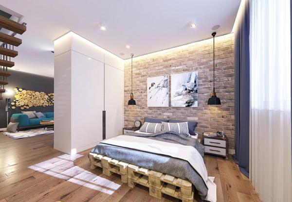 кровать на деревянном помосте в спальне в стиле лофт